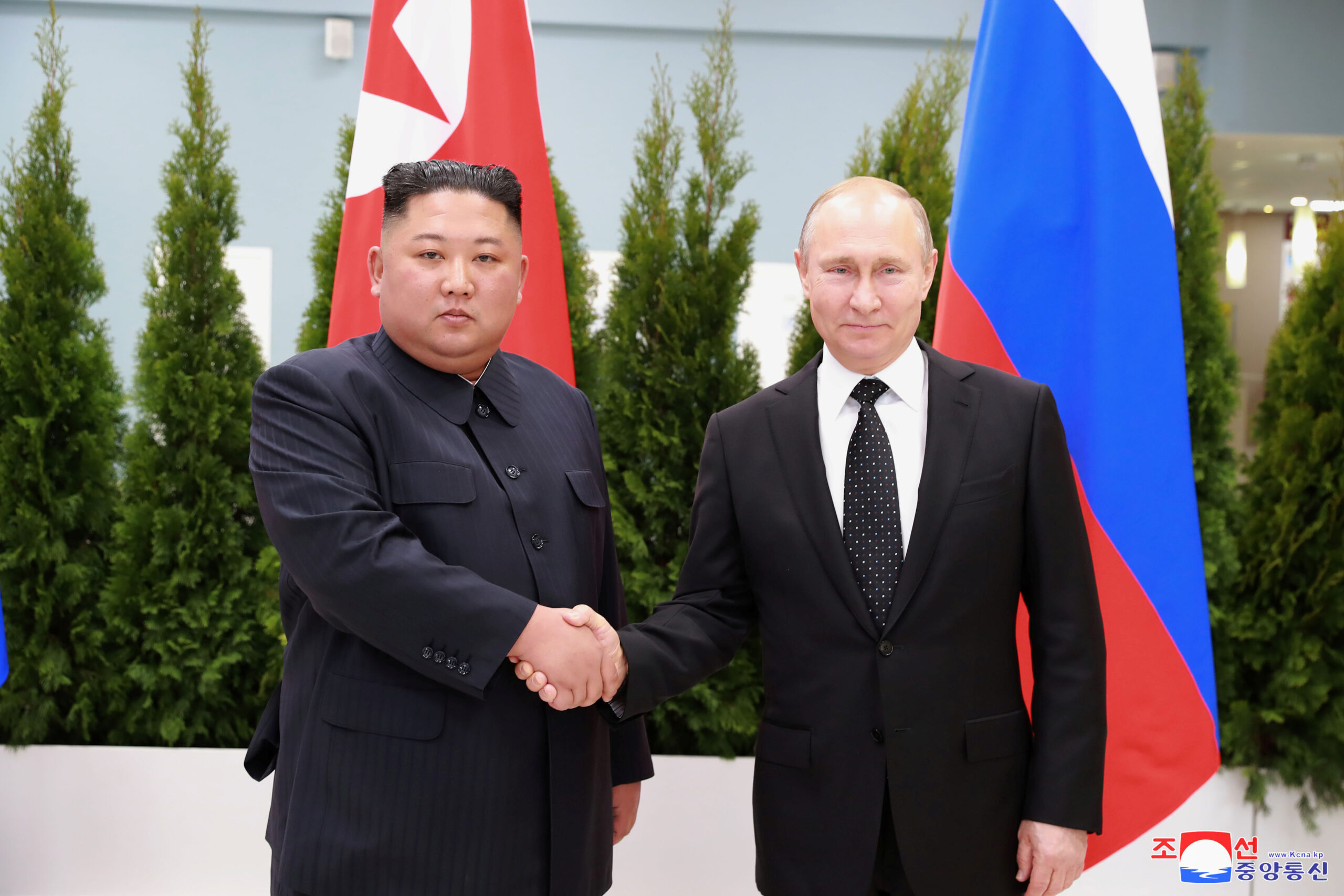 North Korean leader Kim Jong Un shakes hands with Russian President Vladimir Putin in Vladivostok